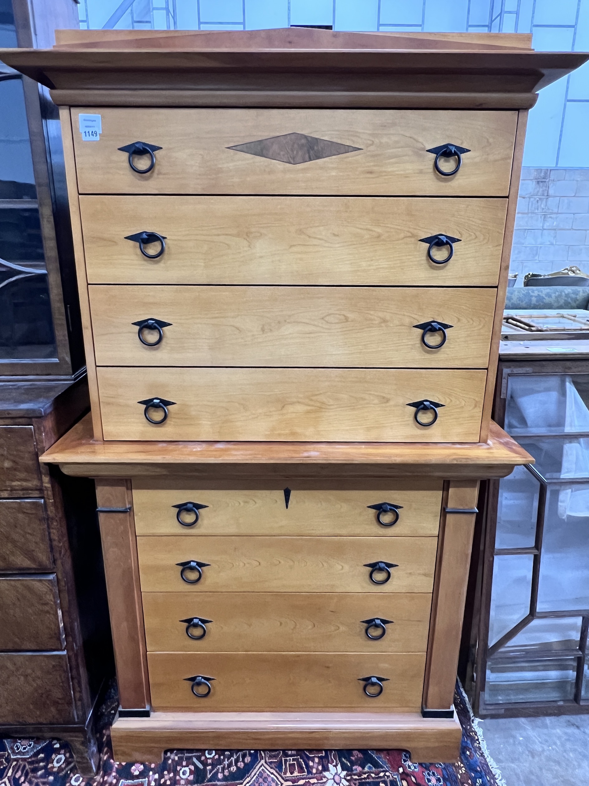 A Biedermeier style bois clair eight drawer chest on chest, width 104cm, depth 55cm, height 173cm